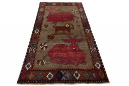 Surface texture of 2000s Persian Gabbeh rug with natural Wool and intricate pattern