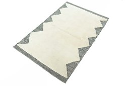 Corner detail of New Persian Gabbeh rug showing border pattern and Wool pile