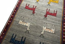 Backside of handmade 2000s Persian Gabbeh rug showing knot structure and weave density