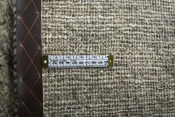Corner detail of 2000s Persian Gabbeh rug showing border pattern and Wool pile