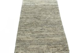 Surface texture of 2000s Persian Gabbeh rug with natural Wool and intricate pattern