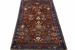 Surface texture of 2000s Persian Gabbeh rug with natural Wool and intricate pattern