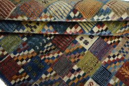 Full view of 2000s Persian Gabbeh rug from Iran / Persia, 189 × 127 cm in Multi Color tones