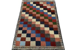 Surface texture of 2000s Persian Gabbeh rug with natural Wool and intricate pattern