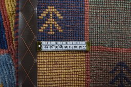Close-up detail of 2000s Persian Gabbeh rug from Iran / Persia showing Wool weave