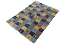 Corner detail of 2000s Persian Gabbeh rug showing border pattern and Wool pile