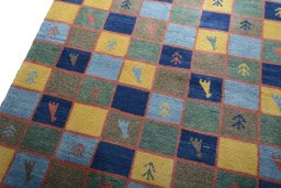 Backside of handmade 2000s Persian Gabbeh rug showing knot structure and weave density