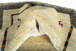 Corner detail of New Persian Gabbeh rug showing border pattern and Wool pile
