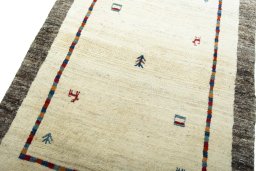 Backside of handmade New Persian Gabbeh rug showing knot structure and weave density