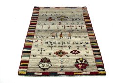Surface texture of 2000s Persian Gabbeh rug with natural Wool and intricate pattern