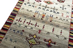 Backside of handmade 2000s Persian Gabbeh rug showing knot structure and weave density