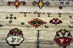 Full view of 2000s Persian Gabbeh rug from Iran / Persia, 136 × 107 cm in Beige tones
