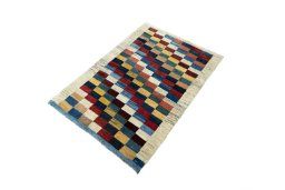 Corner detail of New Persian Gabbeh rug showing border pattern and Wool pile