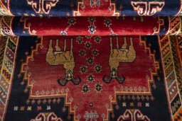 Corner detail of 2000s Persian Gabbeh rug showing border pattern and Wool pile