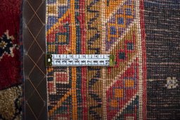 Surface texture of 2000s Persian Gabbeh rug with natural Wool and intricate pattern