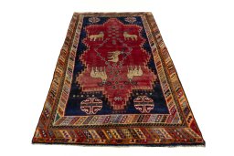 Surface texture of 2000s Persian Gabbeh rug with natural Wool and intricate pattern