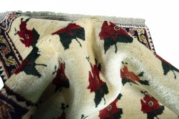 Corner detail of 2000s Persian Gabbeh rug showing border pattern and Wool pile