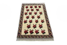 Surface texture of 2000s Persian Gabbeh rug with natural Wool and intricate pattern
