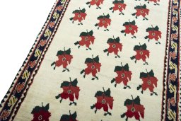 Backside of handmade 2000s Persian Gabbeh rug showing knot structure and weave density