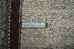 Corner detail of 2000s Persian Gabbeh rug showing border pattern and Wool pile