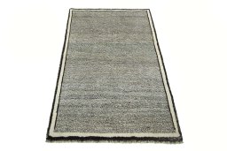 Surface texture of 2000s Persian Gabbeh rug with natural Wool and intricate pattern