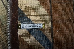Surface texture of 2000s Persian Gabbeh rug with natural Wool and intricate pattern