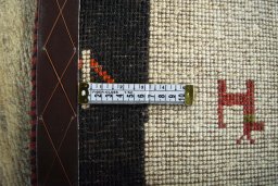 Close-up detail of 2000s Persian Gabbeh rug from Iran / Persia showing Wool weave