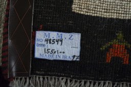 Surface texture of 2000s Persian Gabbeh rug with natural Wool and intricate pattern