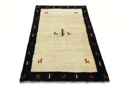 Surface texture of 2000s Persian Gabbeh rug with natural Wool and intricate pattern