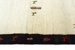 Close-up detail of 2000s Persian Gabbeh rug from Iran / Persia showing Wool weave