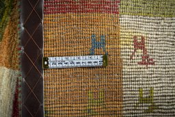 Close-up detail of 2000s Persian Gabbeh rug from Iran / Persia showing Wool weave