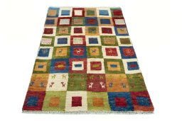 Surface texture of 2000s Persian Gabbeh rug with natural Wool and intricate pattern