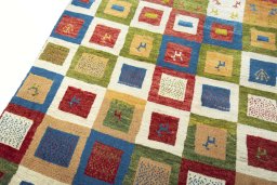 Backside of handmade 2000s Persian Gabbeh rug showing knot structure and weave density