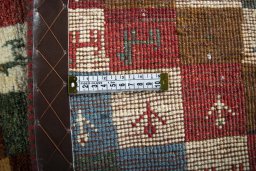 Close-up detail of 2000s Persian Gabbeh rug from Iran / Persia showing Wool weave