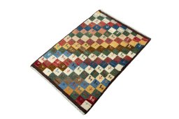 Corner detail of 2000s Persian Gabbeh rug showing border pattern and Wool pile