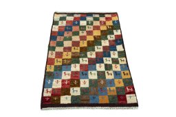 Surface texture of 2000s Persian Gabbeh rug with natural Wool and intricate pattern
