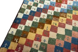 Backside of handmade 2000s Persian Gabbeh rug showing knot structure and weave density
