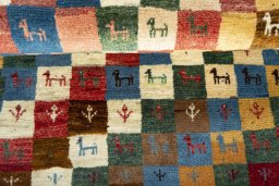 Full view of 2000s Persian Gabbeh rug from Iran / Persia, 120 × 82 cm in Multi Color tones