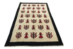 Surface texture of 2000s Persian Gabbeh rug with natural Wool and intricate pattern