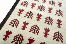 Backside of handmade 2000s Persian Gabbeh rug showing knot structure and weave density