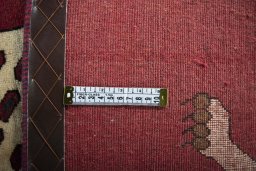Corner detail of 2000s Persian Gabbeh rug showing border pattern and Wool pile