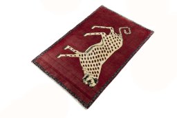 Corner detail of 2000s Persian Gabbeh rug showing border pattern and Wool pile
