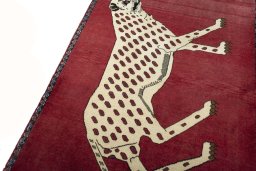 Backside of handmade 2000s Persian Gabbeh rug showing knot structure and weave density