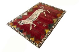 Corner detail of 2000s Persian Gabbeh rug showing border pattern and Wool pile