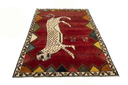 Surface texture of 2000s Persian Gabbeh rug with natural Wool and intricate pattern