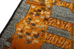 Backside of handmade 2000s Persian Gabbeh rug showing knot structure and weave density