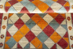Full view of 2000s Persian Gabbeh rug from Iran / Persia, 185 × 120 cm in Multi Color tones