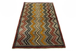 Corner detail of 2000s Persian Gabbeh rug showing border pattern and Wool pile