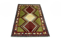 Surface texture of 2000s Persian Gabbeh rug with natural Wool and intricate pattern