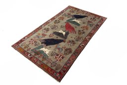 Corner detail of 2000s Persian Gabbeh rug showing border pattern and Wool pile